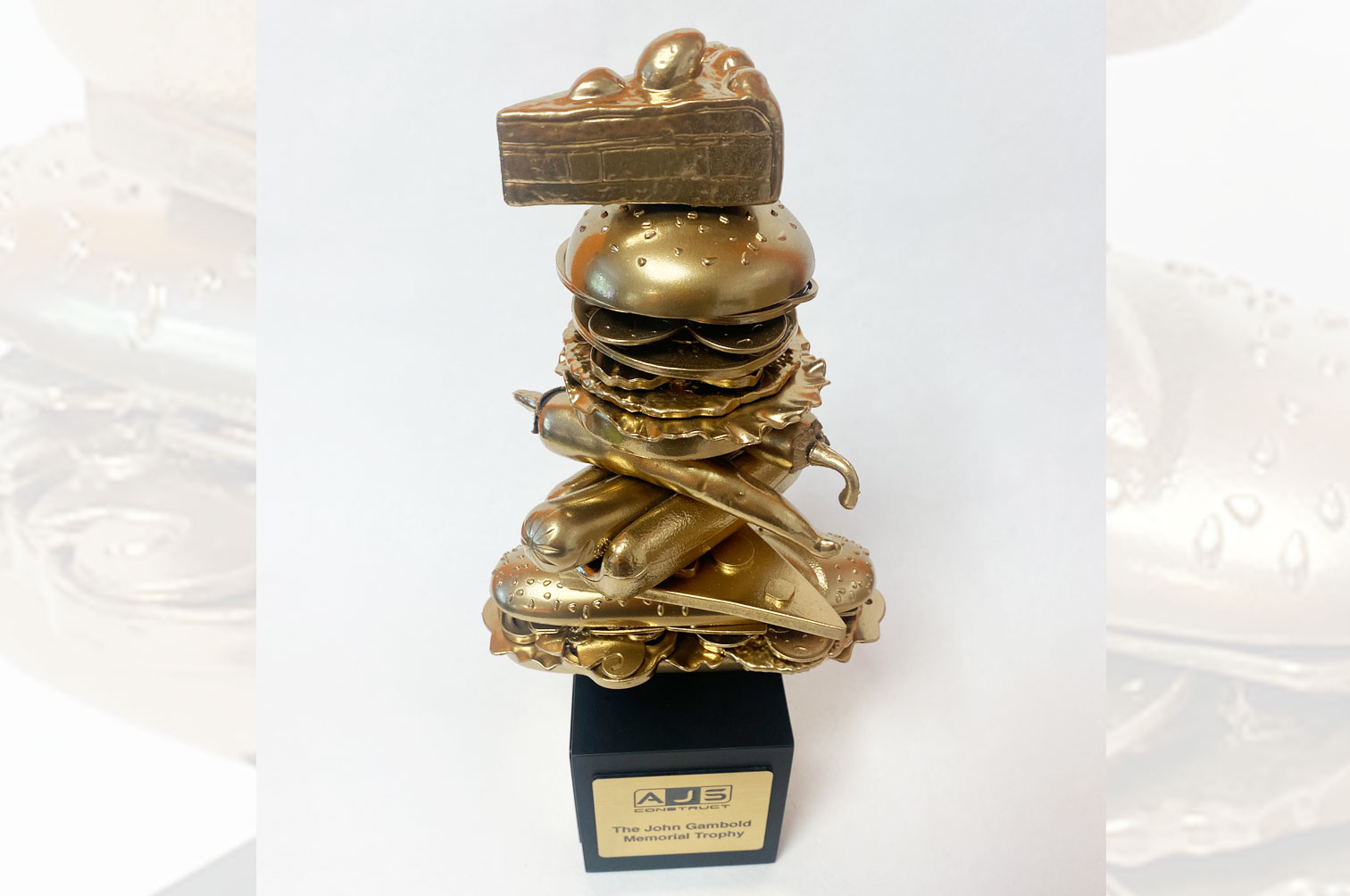 Bespoke gold food eating competition trophy.